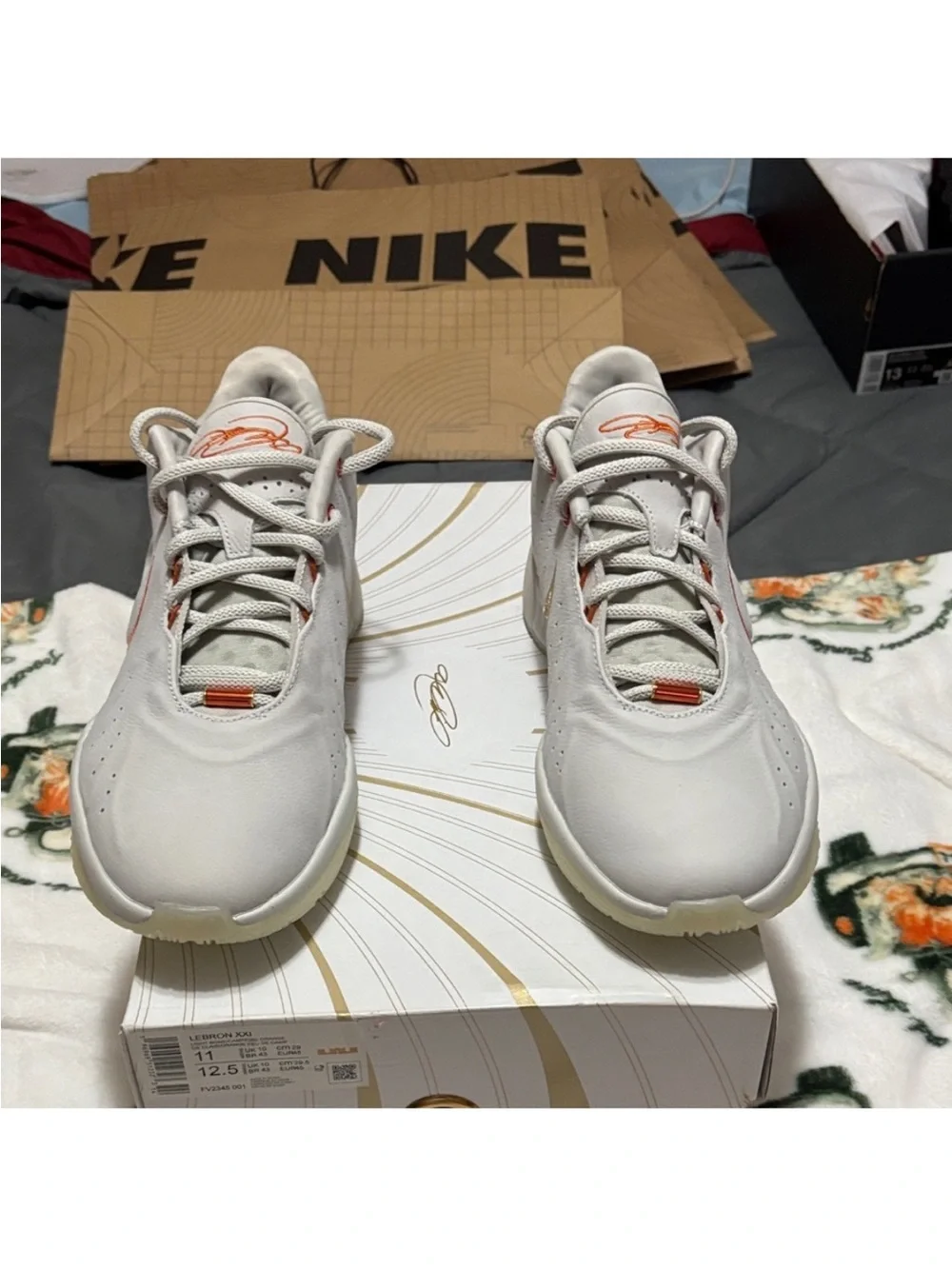 Nike LeBron James 21 Men’s Light Gray Sneakers with Orange Detailing
